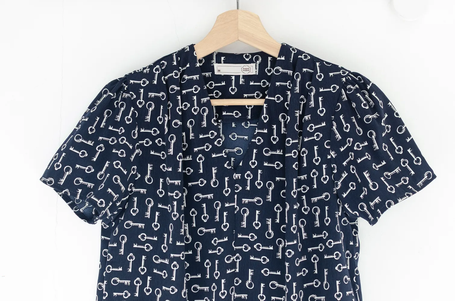 MT0601 V-Collar Key Print Blouse – Navy Blue - Image 3