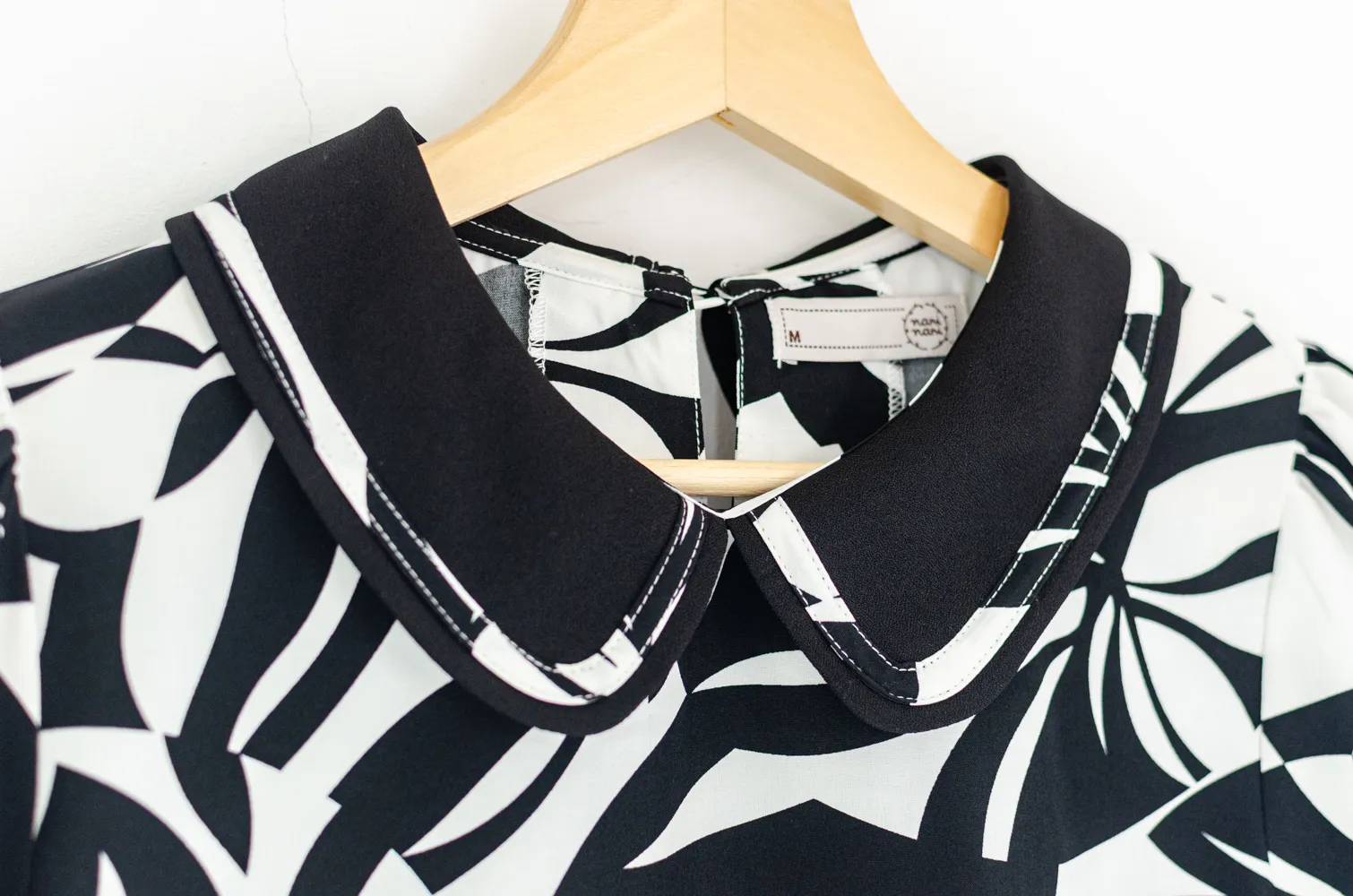 MT4101 Trimmed Peter Pan Collar Blouse – Black Graphic - Image 4